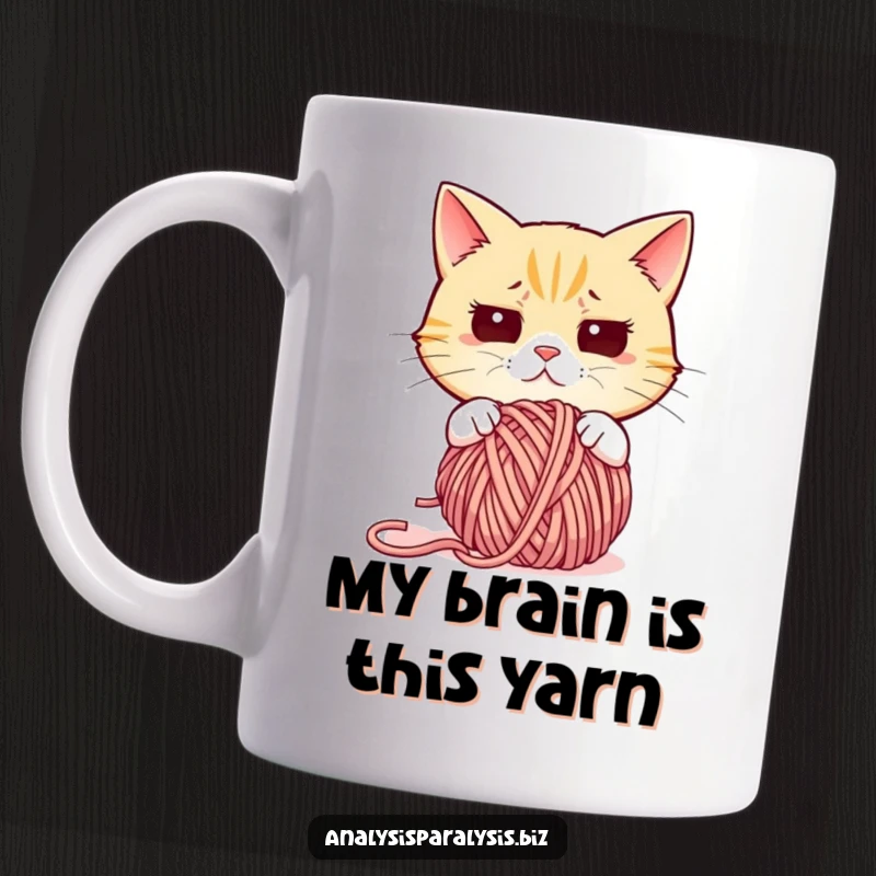 Funny cat mug featuring a bewildered feline staring intensely at a chaotic mess of tangled yarn, embodying pure confusion.