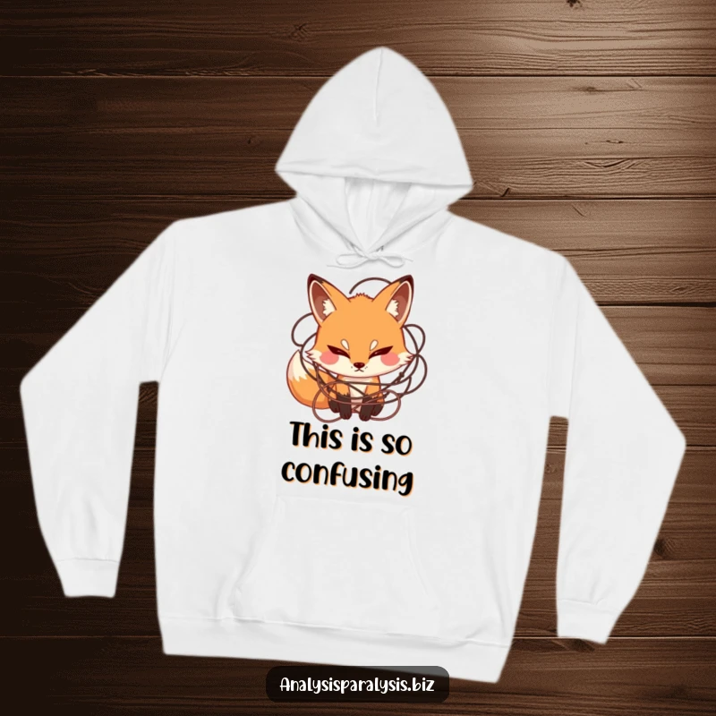 Funny hoodie featuring a curious fox with a furrowed brow, caught in a web of tangled string, perfect for cozy contemplation.