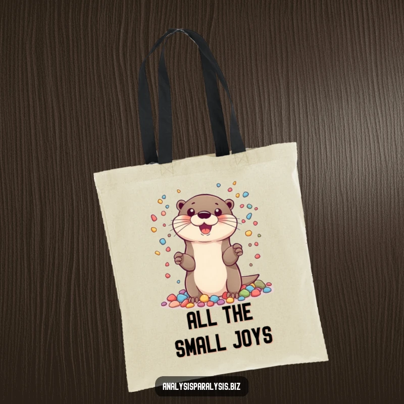 Funny tote bag depicting a cheerful otter juggling a large amount of small, colorful pebbles, ideal for shopping and daily use.